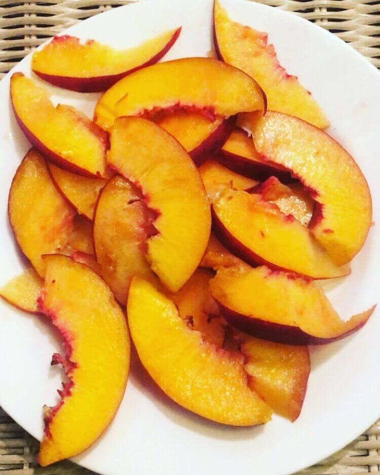 Slices of freestone Bennett Peaches prepped for freezing. 